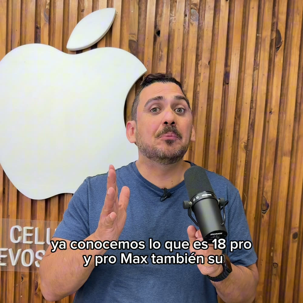 Cuadro del video de Celulares Nuevo Saavedra: el dueño hablando a cámara con un micrófono, frente al logo de Apple del local